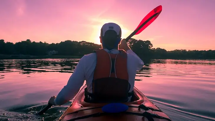 A man is Paddling a kayak- how to paddle kayak